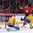 MONTREAL, CANADA - DECEMBER 28: Switzerland's Calvin Thurkauf #12 celebrates after a frist period goal by Jonas Siegenthaler #25 (not shown) against Sweden's Felix Sandstrom #1 while Jacob Larsson #4 looks on during preliminary round action at the 2017 IIHF World Junior Championship. (Photo by Andre Ringuette/HHOF-IIHF Images)

